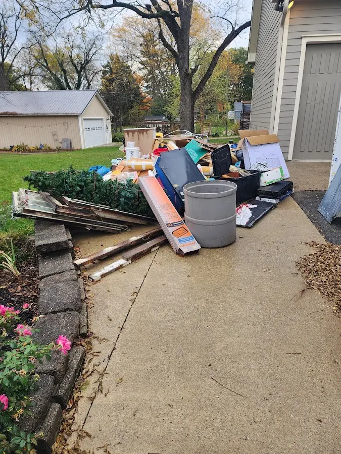 Dumpster being loaded with debris for Roofing Dumpster Rental in Country Walk